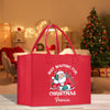 a red shopping bag with a santa clause on it