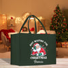 a green shopping bag with a santa clause on it