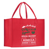 a red shopping bag with a christmas message on it