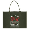 a green christmas shopping bag with santa's sleigh on it