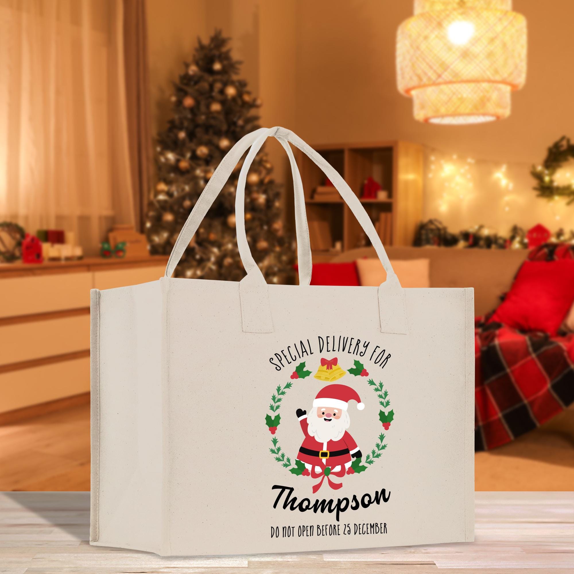 a white shopping bag with a santa clause on it