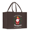 a brown shopping bag with a santa clause on it