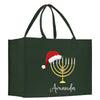 a green bag with a menorah and a santa hat on it