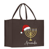 a brown bag with a menorah and a santa hat on it