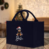 a black bag with a dachshund wearing a santa hat