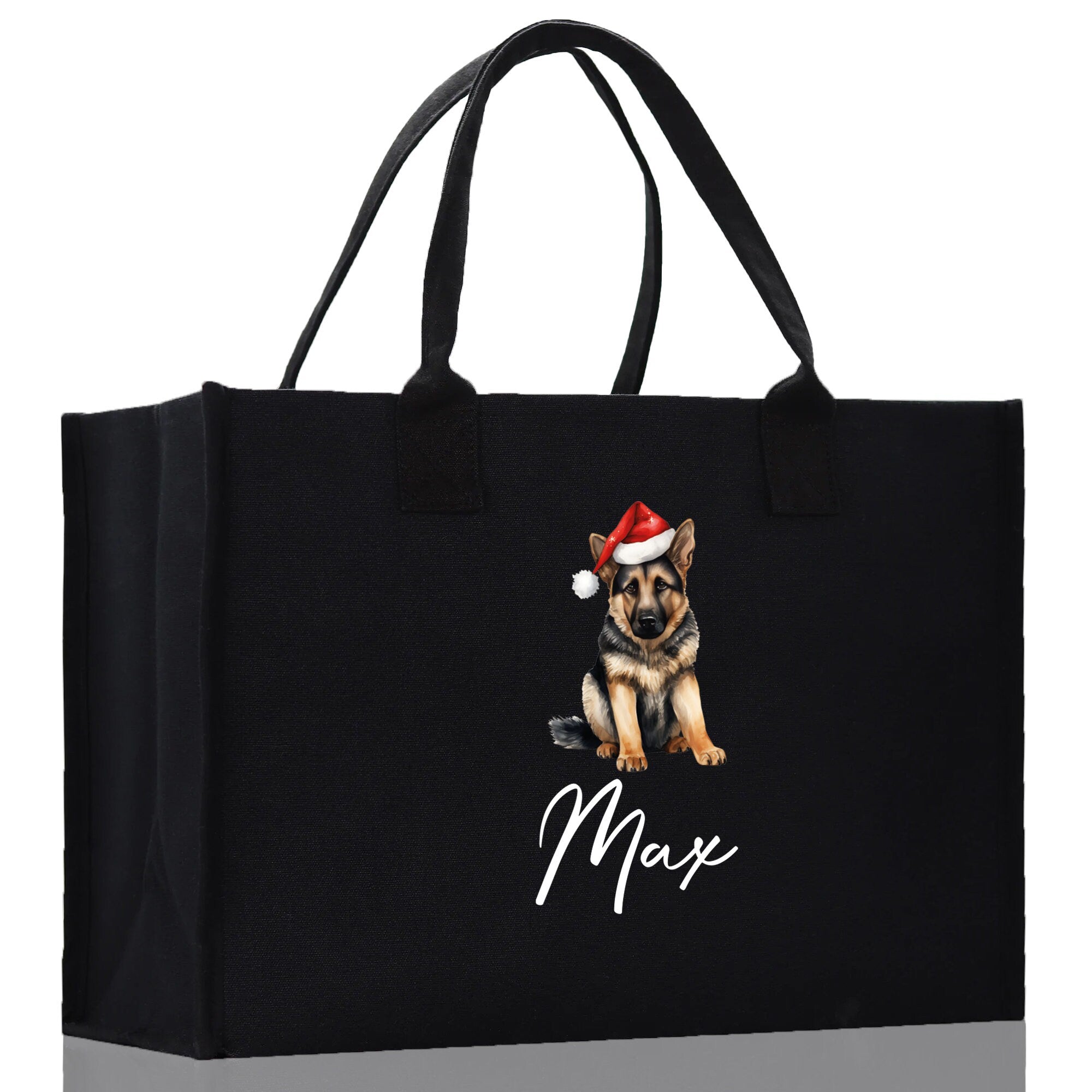 a black shopping bag with a dog wearing a santa hat