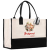 a black and white bag with a bouquet of flowers on it