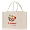 a white bag with a bouquet of flowers on it