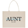 a white shopping bag with a black and blue logo