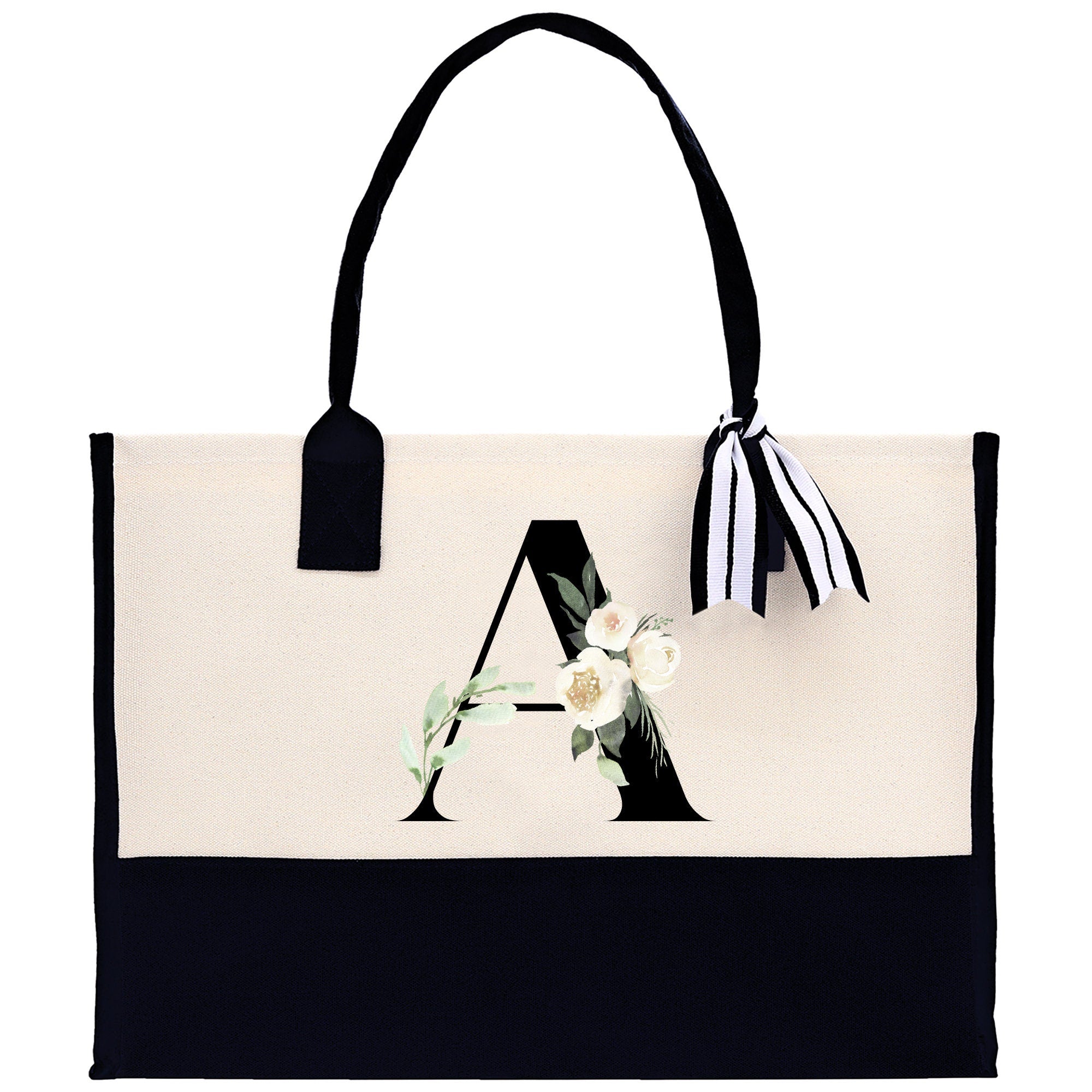 a black and white tote bag with a monogrammed letter