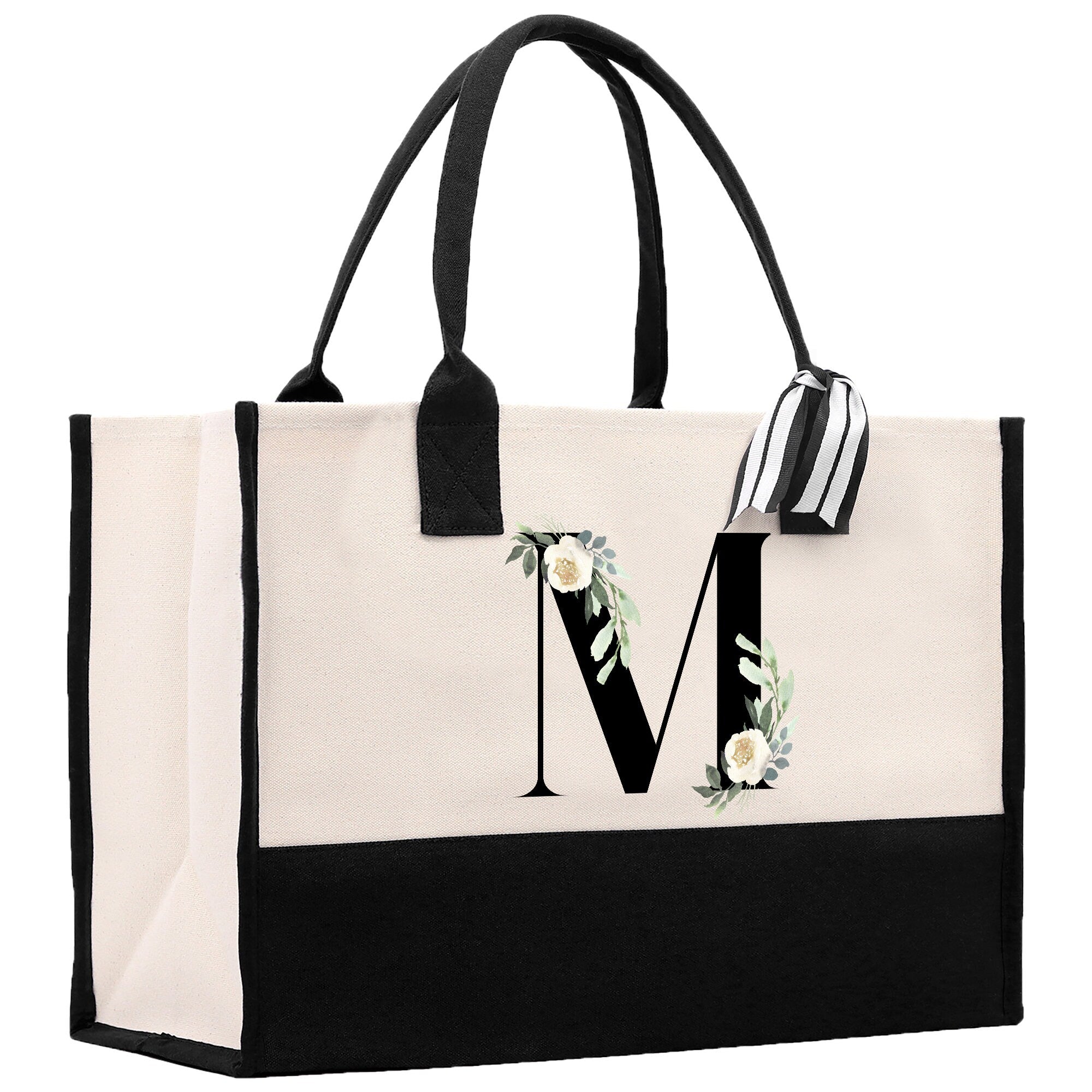 a black and white bag with a monogrammed m on it