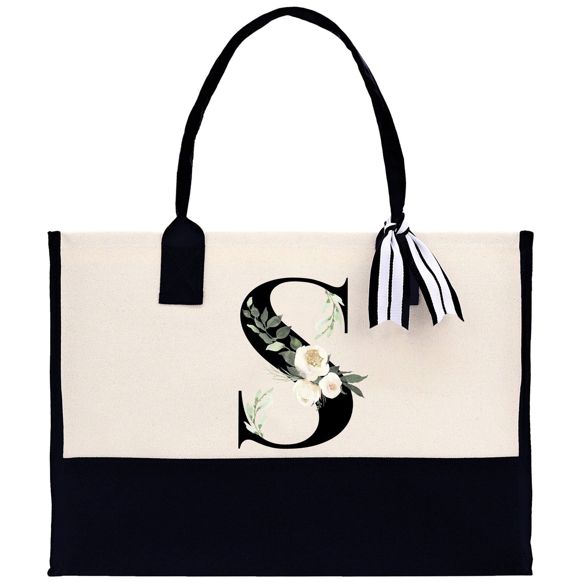 a black and white bag with a flower on it