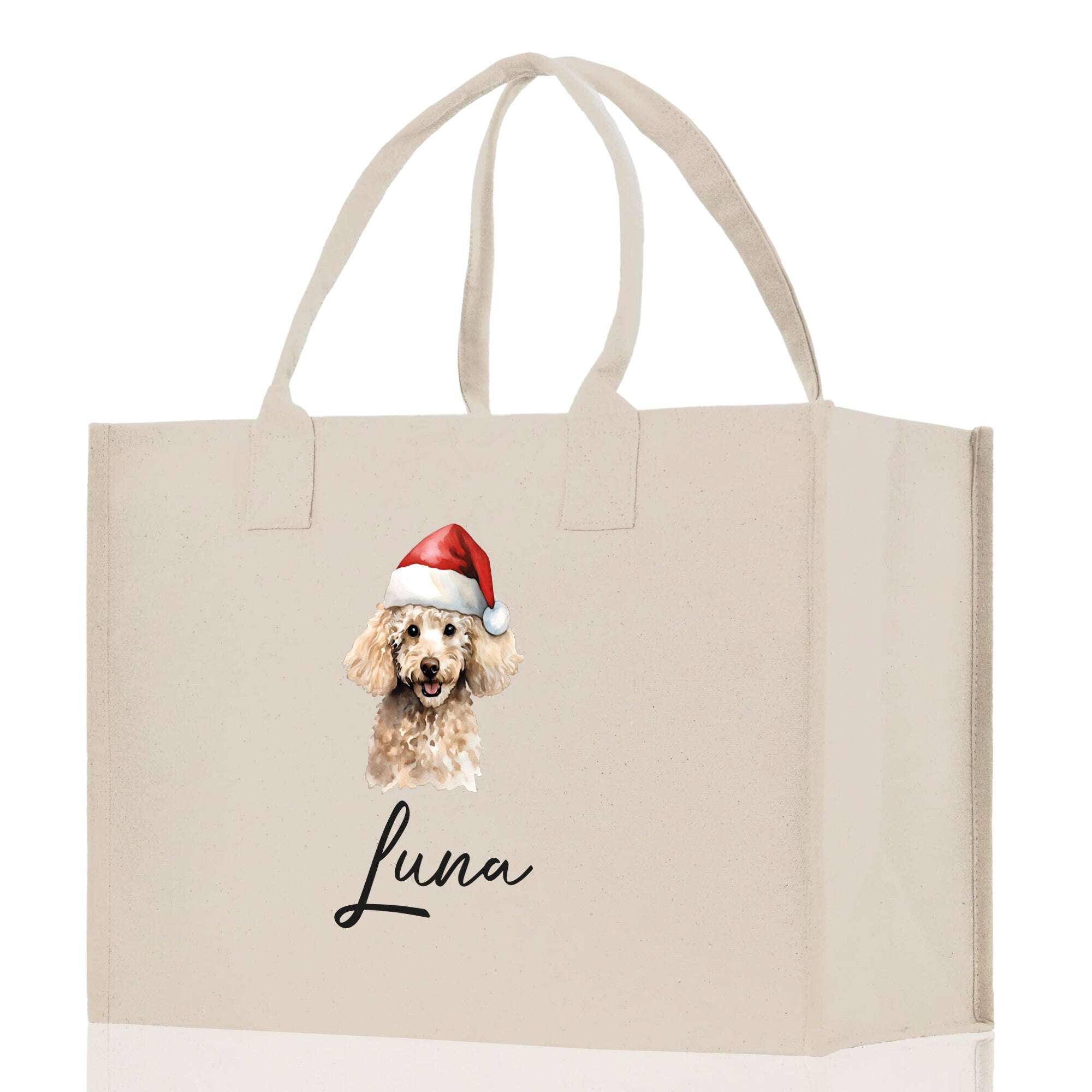 a white shopping bag with a picture of a dog wearing a santa hat