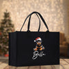 a black bag with a picture of a dog wearing a santa hat