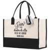 a black and white shopping bag with a bow on it