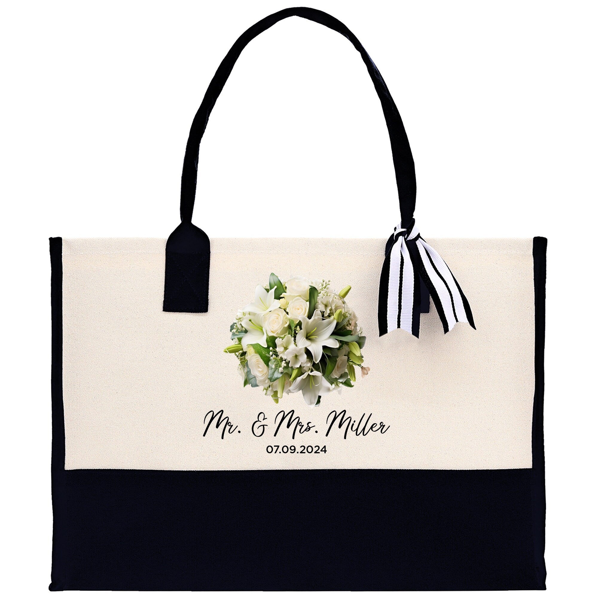 a black and white tote bag with a bouquet of flowers