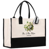 a black and white tote bag with flowers on it