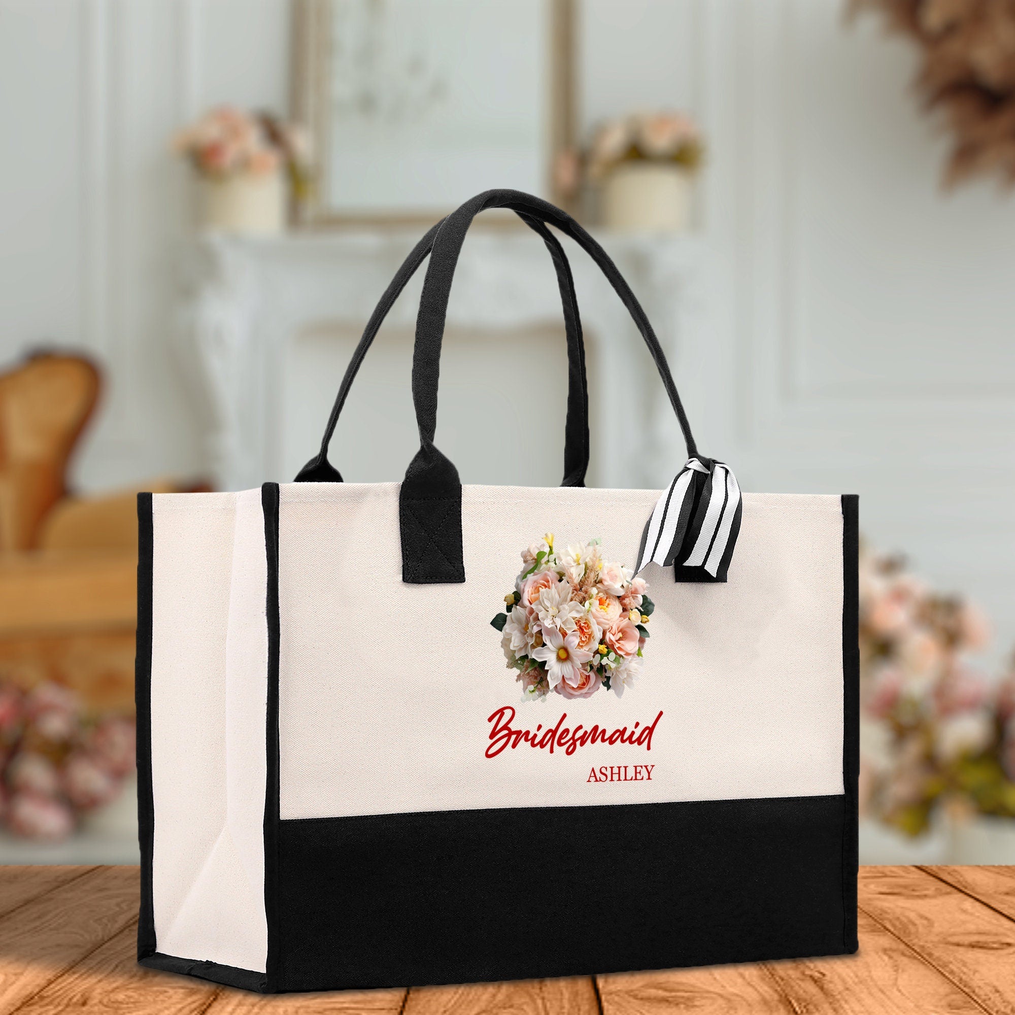 a black and white bag with flowers on it