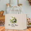 a white bag with a bouquet of flowers on it