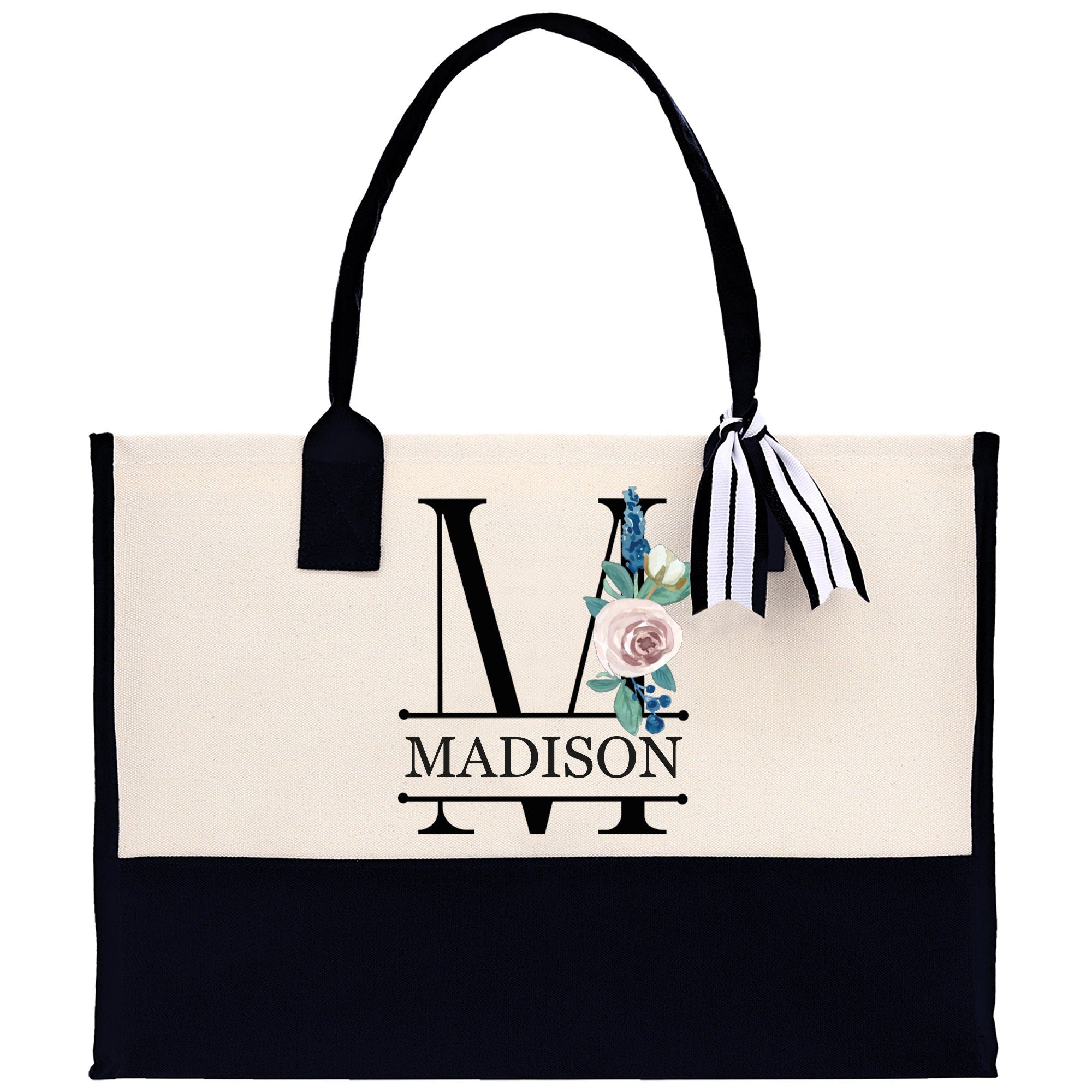 a black and white bag with a monogrammed design