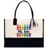 a black and white bag with crayons on it