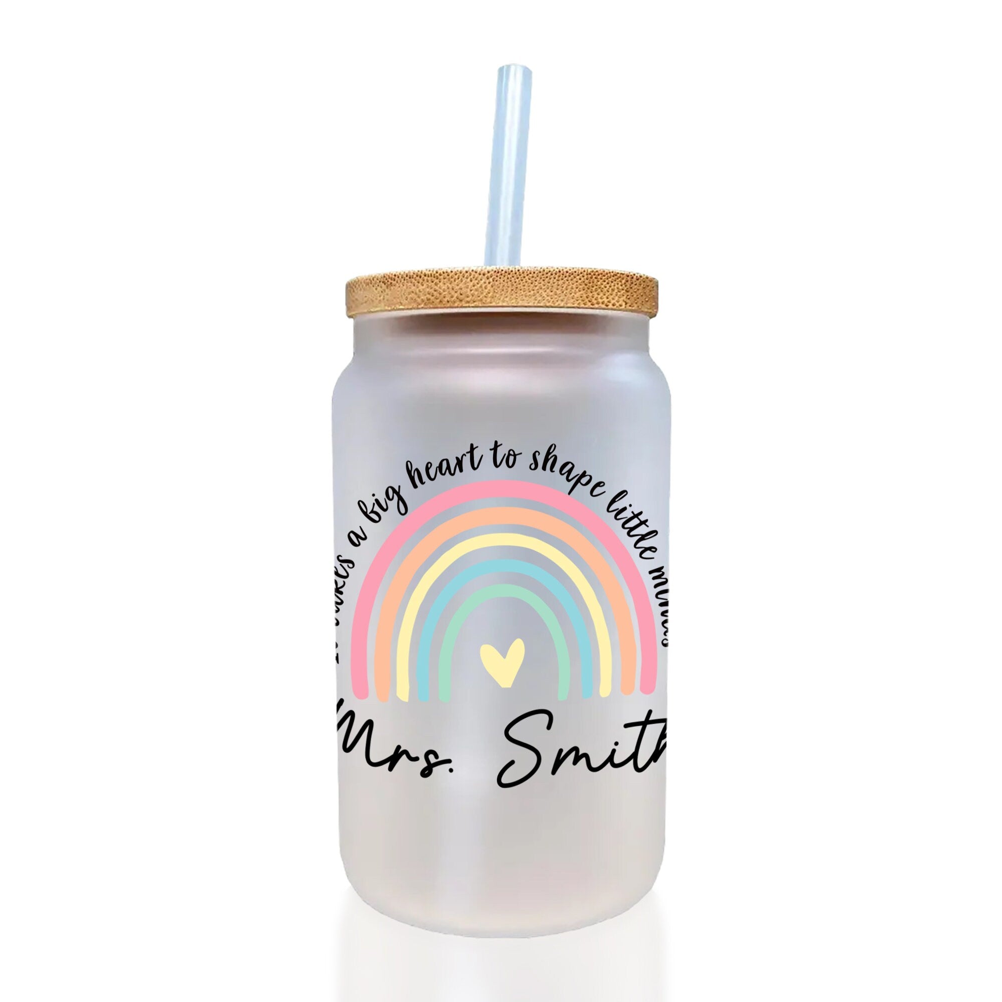 a mason jar with a straw and a rainbow on it