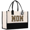 a black and white tote bag with the word mom printed on it