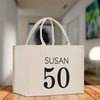 a white shopping bag with the number fifty on it