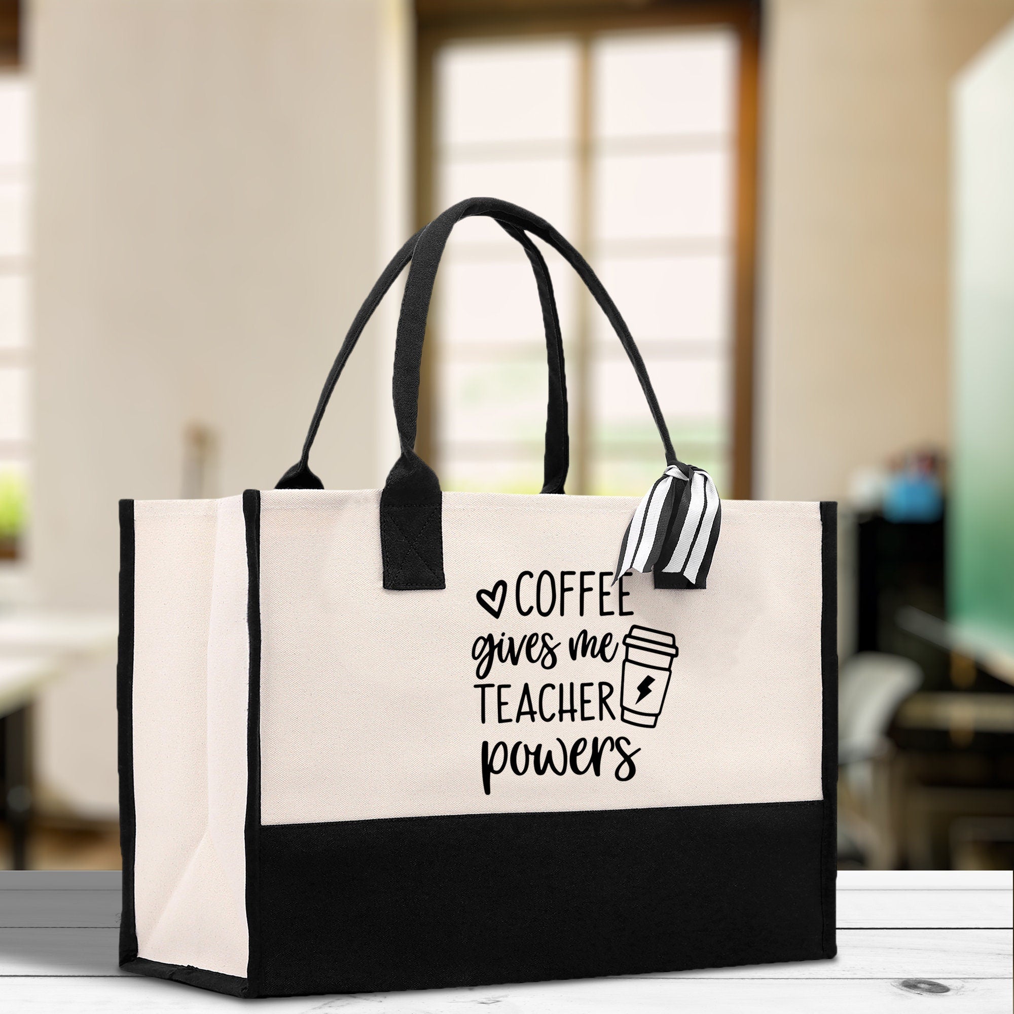 a black and white bag with coffee gives me teacher power