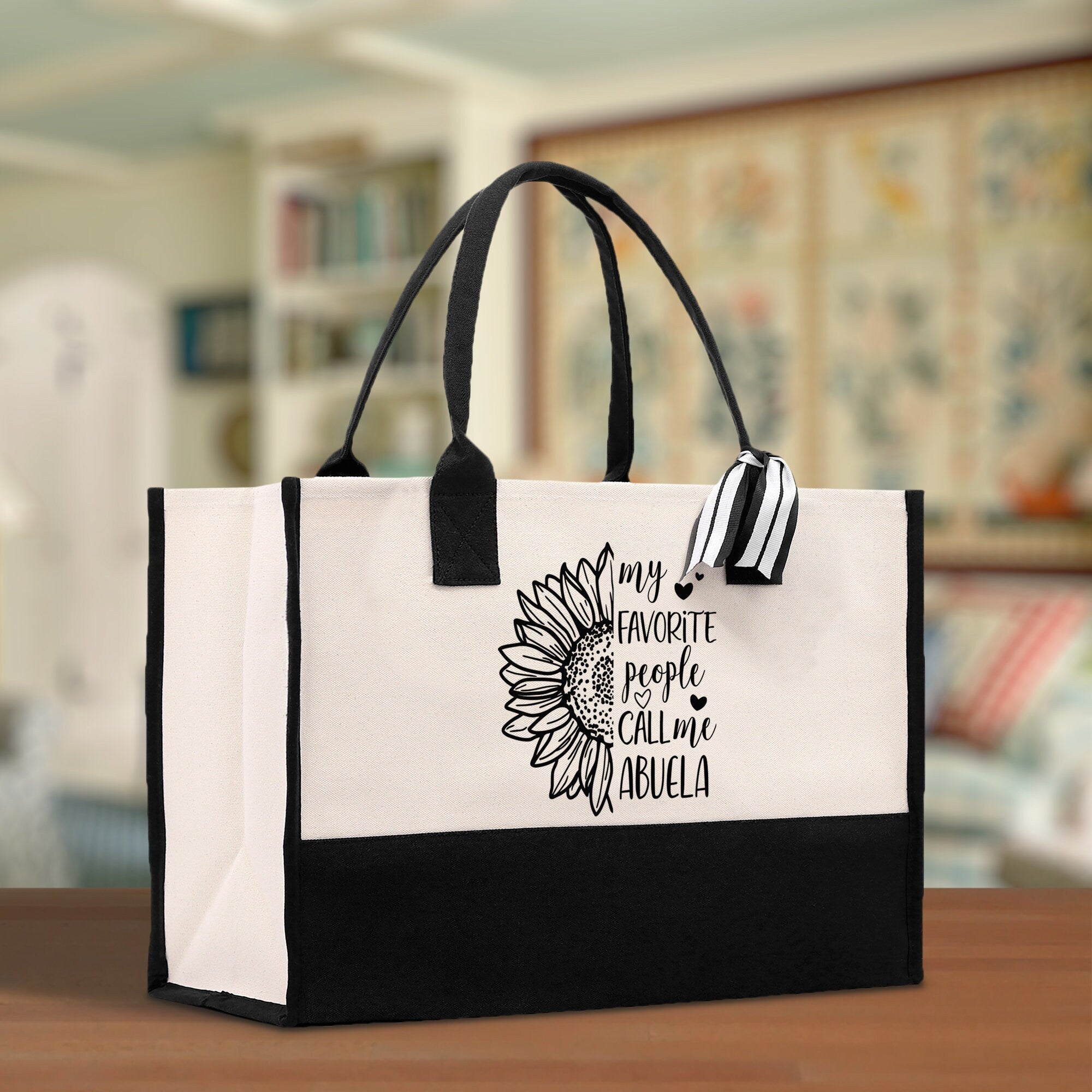 a black and white bag with a sunflower on it