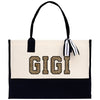 a black and white bag with gold letters on it