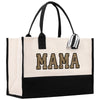 a black and white bag with the word mam printed on it