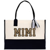 a black and white bag with the word mim printed on it