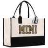 a black and white bag with the word mimi printed on it