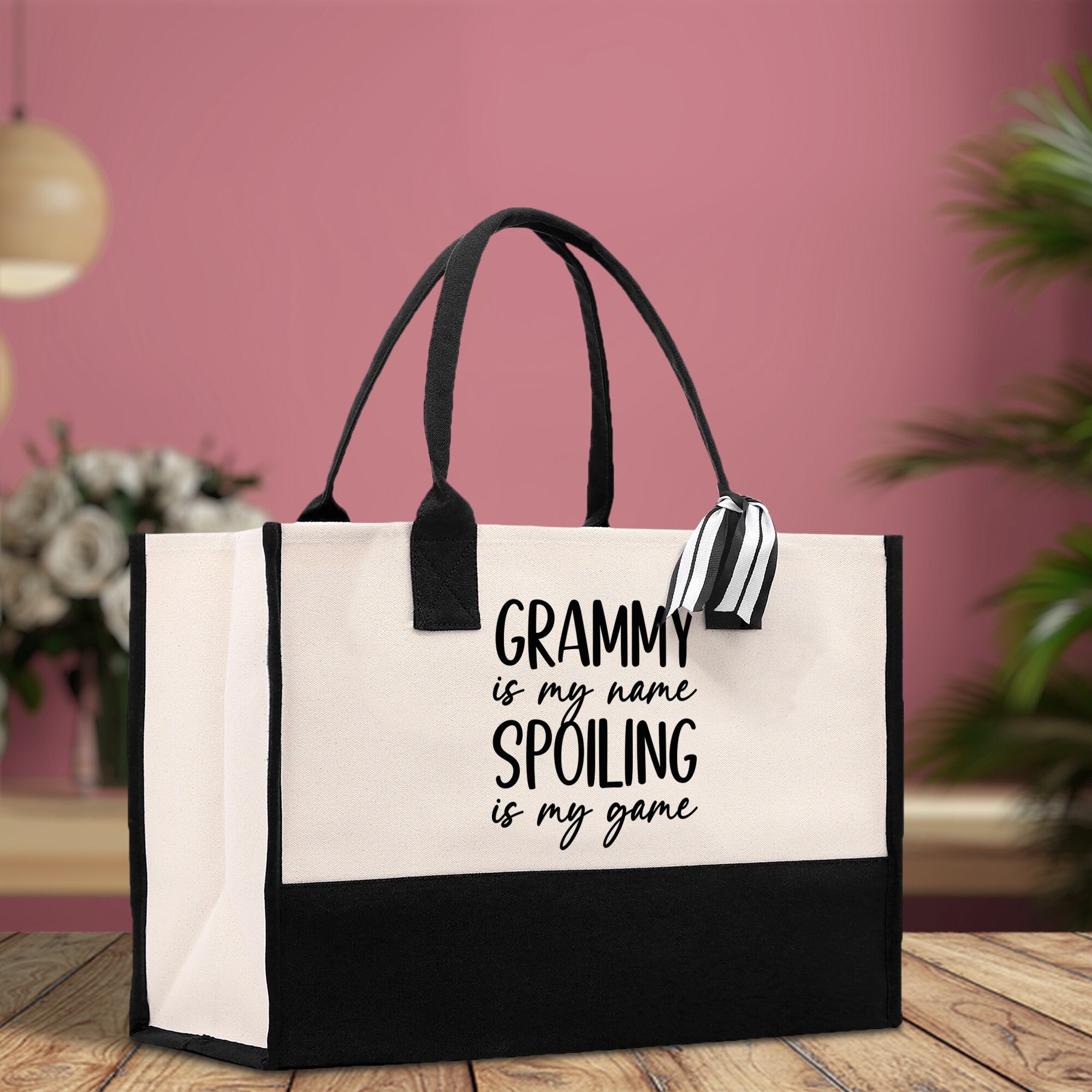 a black and white bag with a saying on it