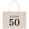 a white shopping bag with the number 50 printed on it