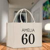 a white shopping bag with the number sixty on it