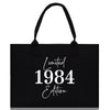 a black shopping bag with the words limited 1994 written on it