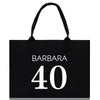 a black shopping bag with the number 40 printed on it