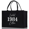 a black shopping bag with the year 1994 printed on it