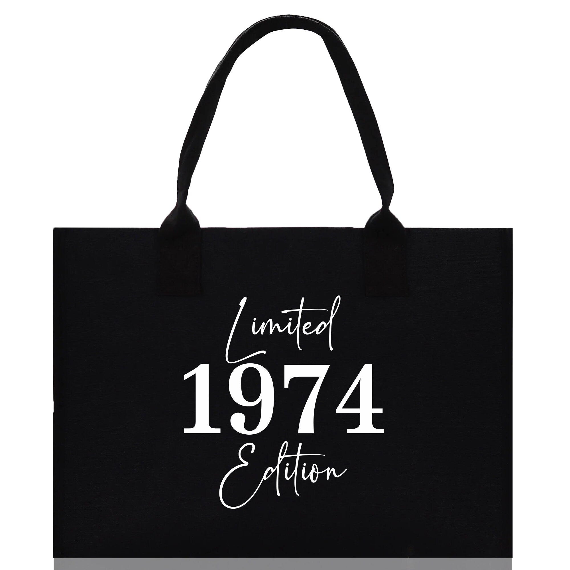 a black tote bag with white lettering on it
