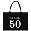 a black shopping bag with the number 50 printed on it