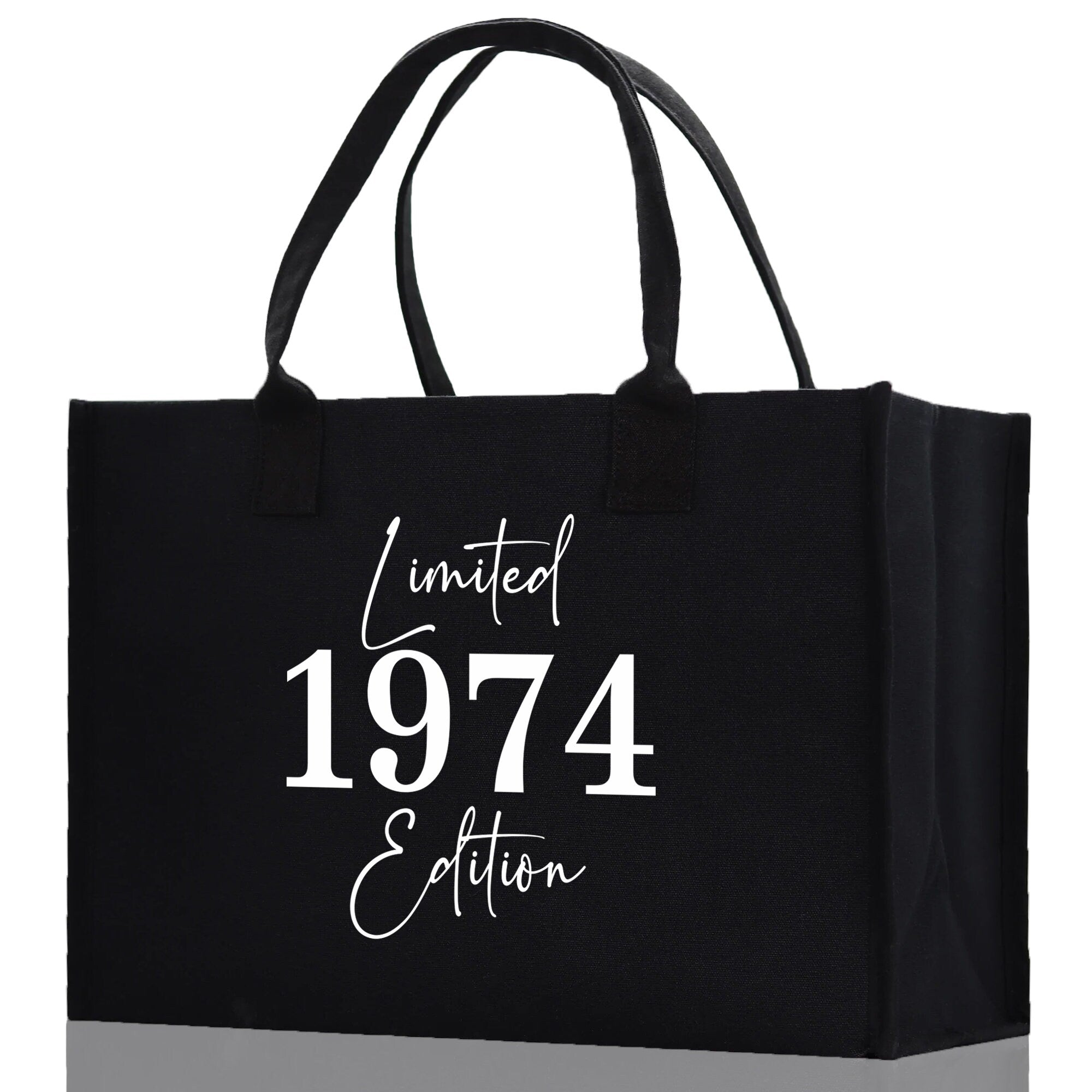 a black shopping bag with the year 1974 printed on it