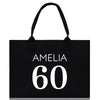 a black shopping bag with the number 60 printed on it