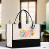 a black and white bag with a flower design