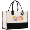 a white and black tote bag with a flower design
