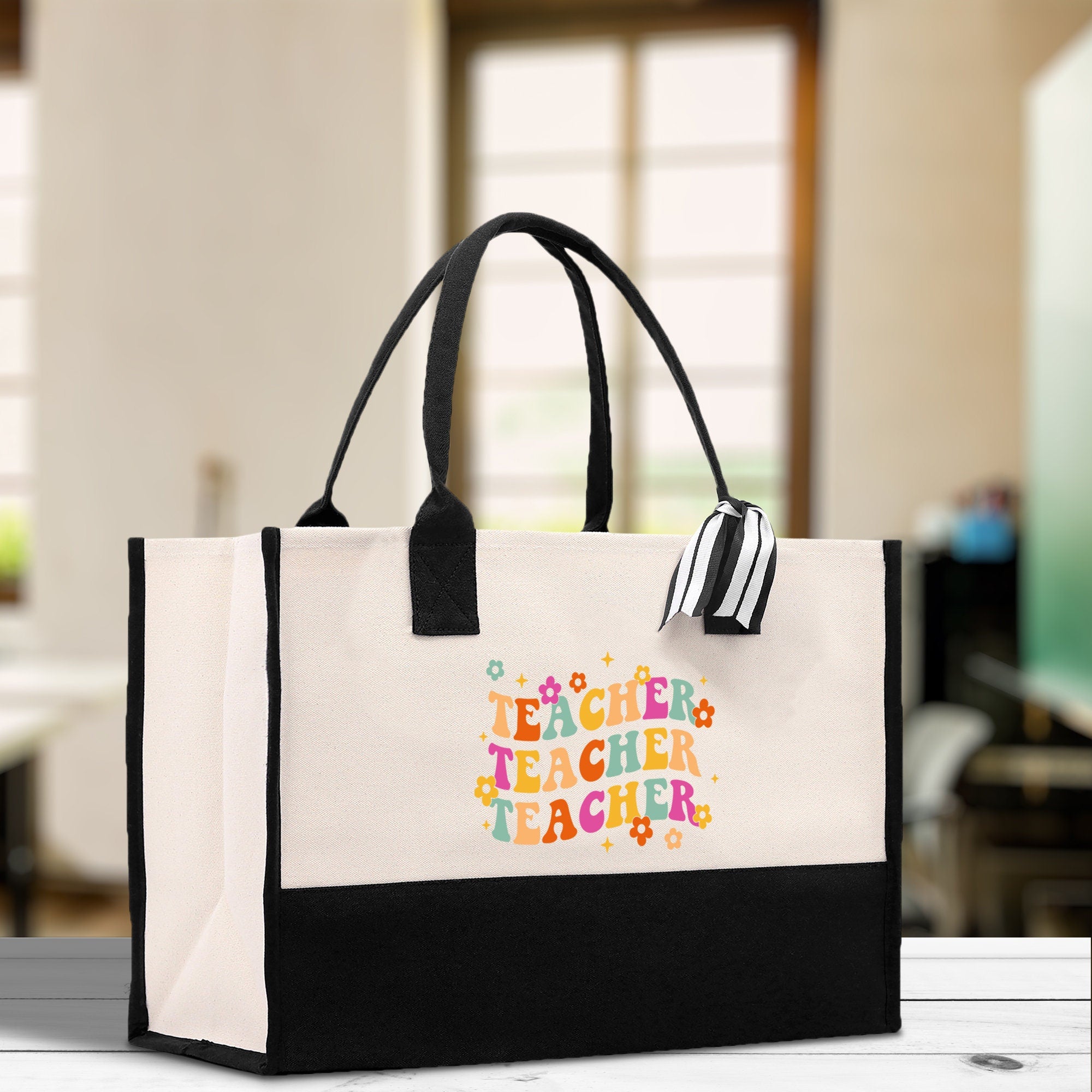 a black and white bag with a teacher&#39;s name on it