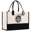 a black and white tote bag with scissors on it
