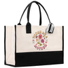 a black and white tote bag with flowers on it