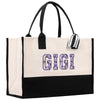 a white and black tote bag with the word gig printed on it